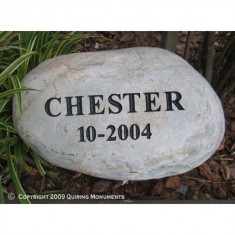 A simple memorial for Chester, engraved on river rock. A simple memorial for Chester, engraved on river rock.